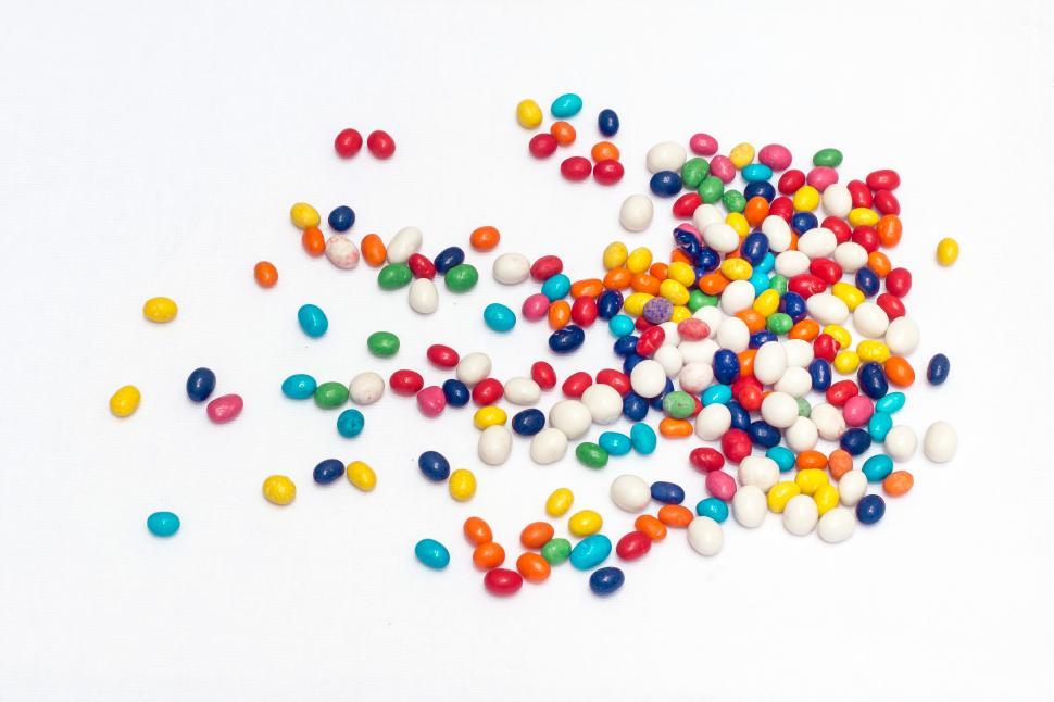 Free Image of colorful candy scattered on white 