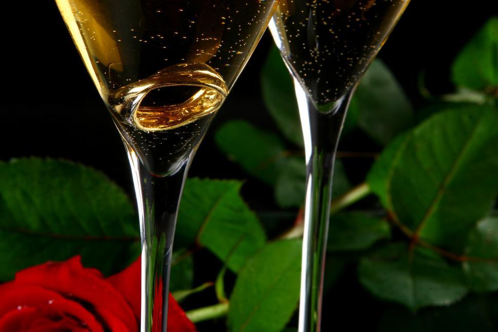 Free Image of two champagne glasses with ring inside 