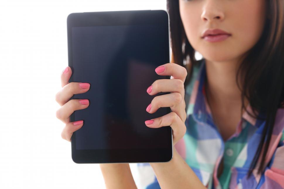 Free Image of Girl holding a tablet 