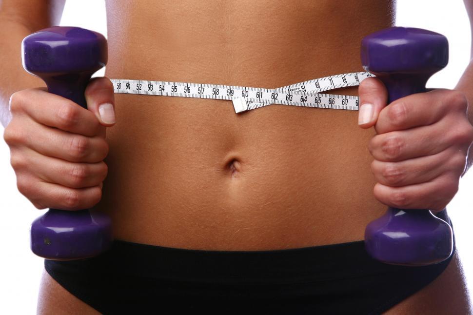 Free Image of flat stomach weights and tape measure 