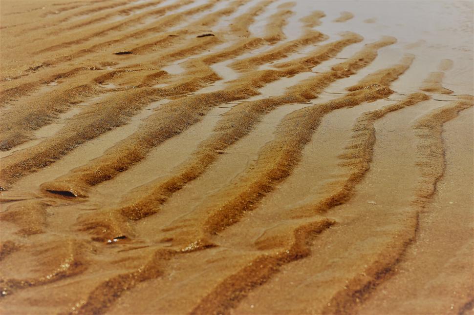 Free Image of Ripples in sand on a beach  