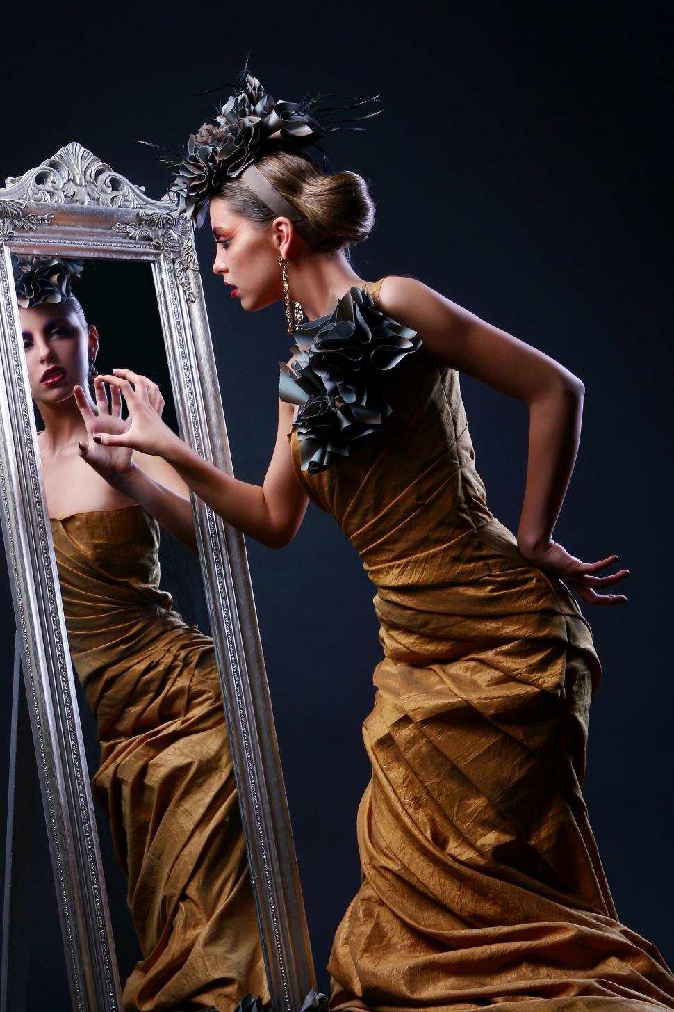 Free Image of beautiful young woman in stylish mirror image 