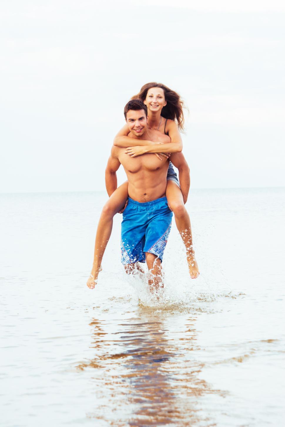 Download Free Stock Photo of Couple enjoying the beach 
