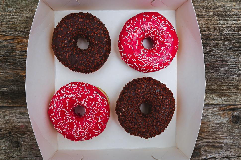 Free Image of Box of Four Delicious donuts 