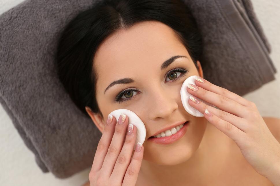 Free Image of Woman cleansing face with pads 