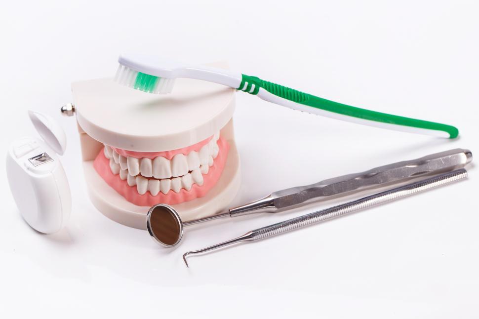 Free Image of White teeth and dental instruments 