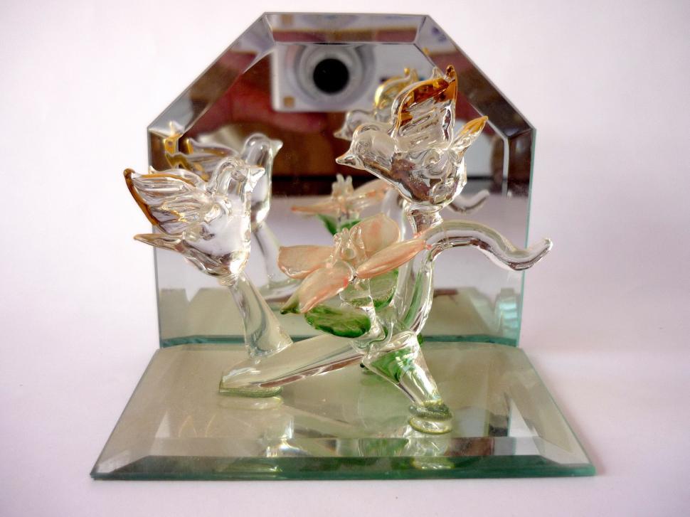 Free Image of Glass Figurine of Man Riding Horse 