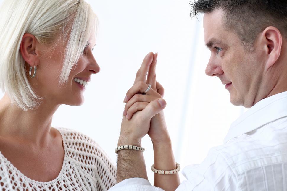 Free Image of Beautiful couple with clasped hands 