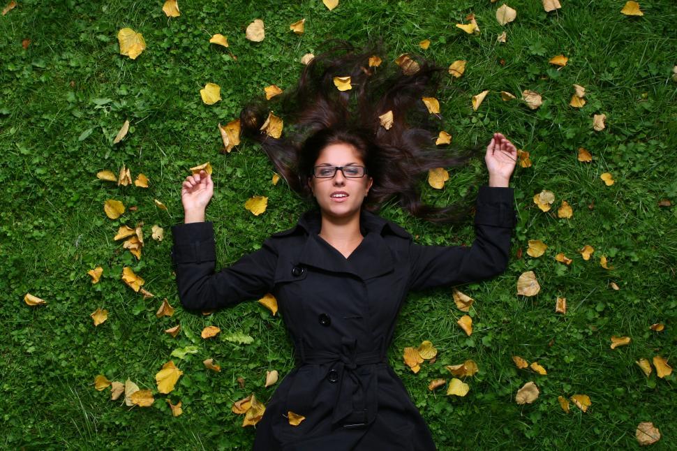 Free Image of young and happy woman on the grass 
