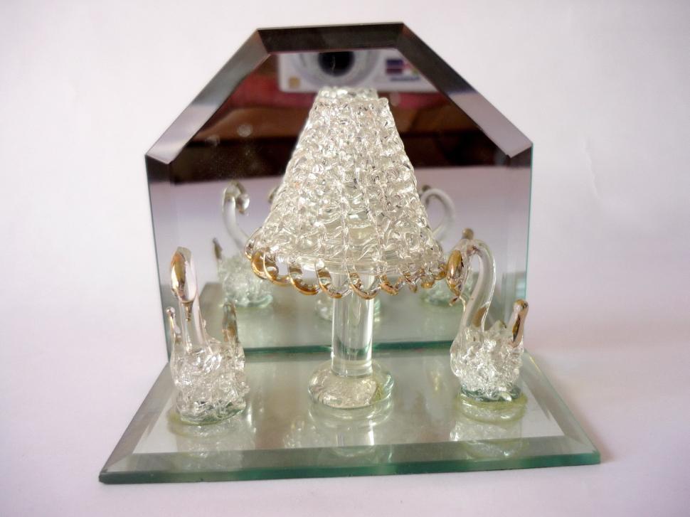 Free Image of Glass Display Case With Glass House Figurine 