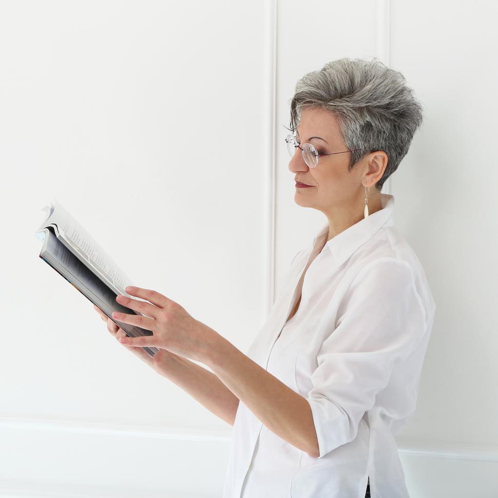 Free Image of Elderly woman with reading material 