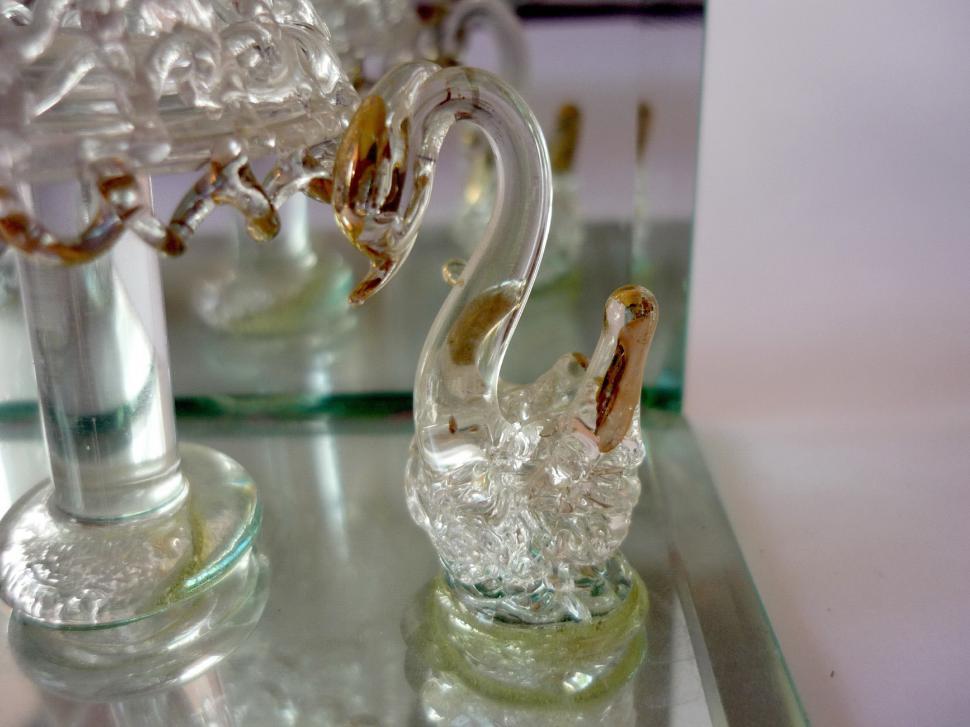Free Image of Glass Swan Figurine on Glass Table 