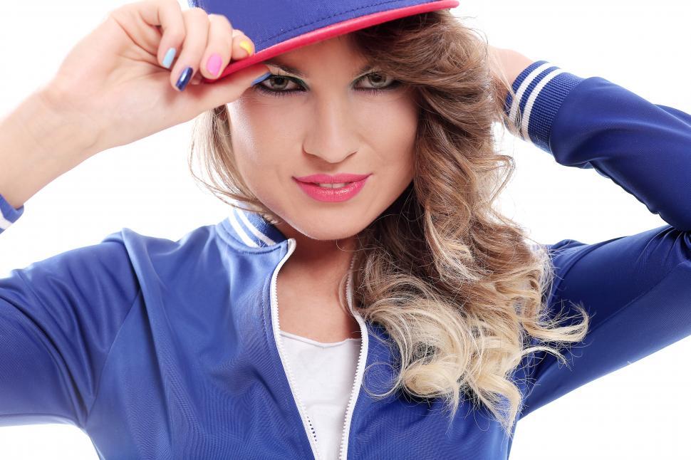 Free Image of Girl with curls wearing a cap 