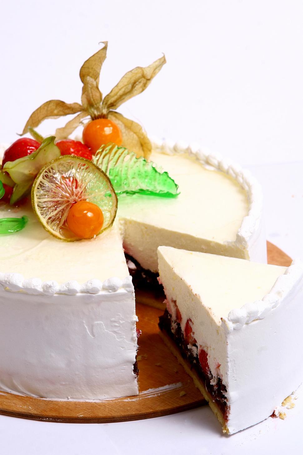 Free Image of dessert fruitcake with one slice removed 