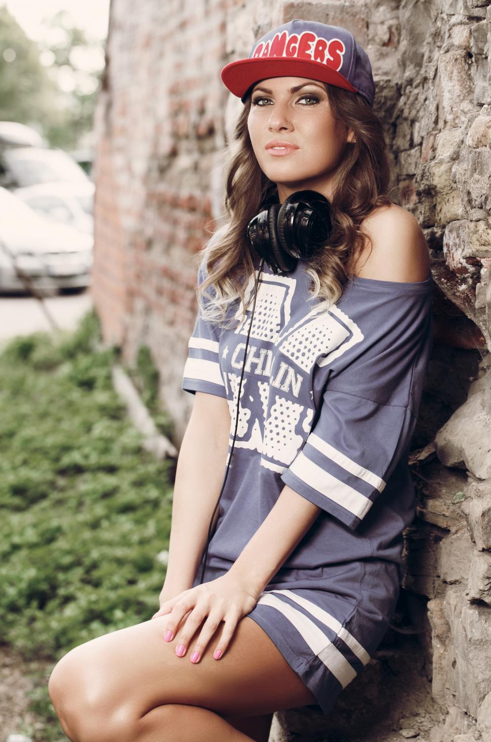 Free Image of Swag. Beautiful girl in the cap and headphones 