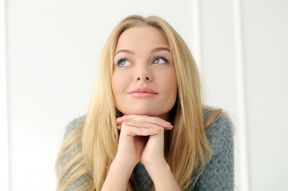 Free Image of Attractive blonde at home looking wistful 