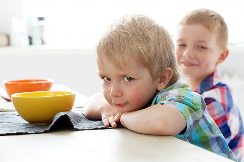 Free Image of Brothers by the table - cute kid after breakfast 