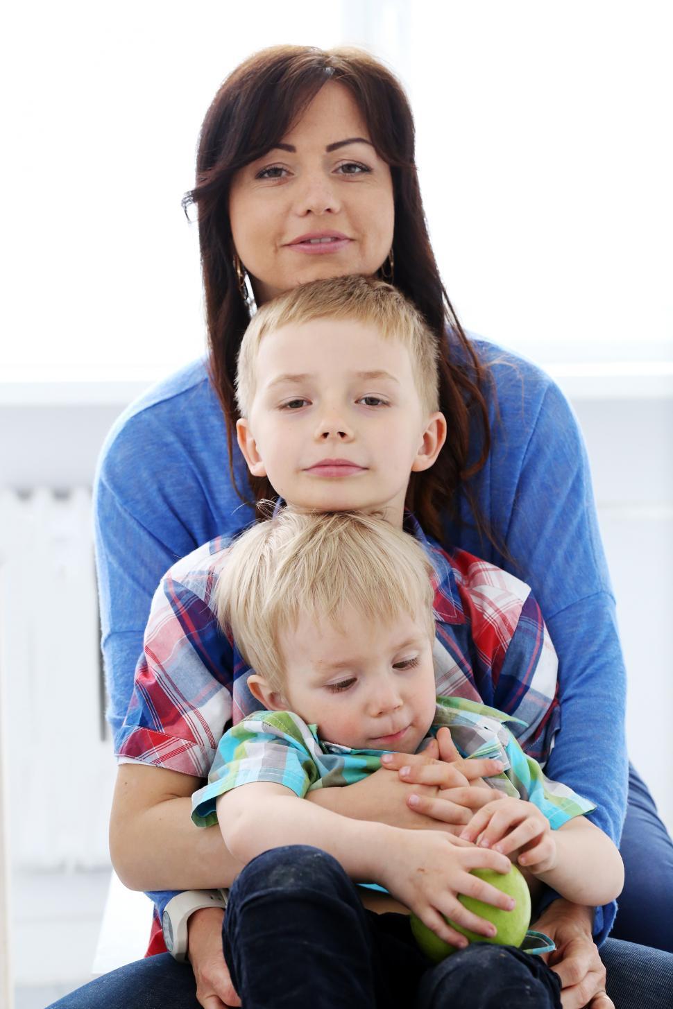 Free Image of Family sitting together on top of each other 