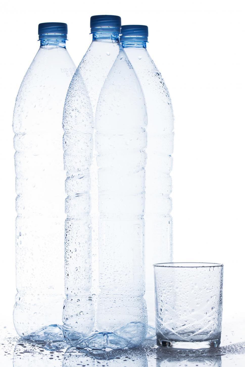 Free Image of Empty water bottles with water glass 