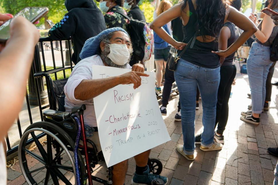 Free Image of Man with Sign Protesting Racism 