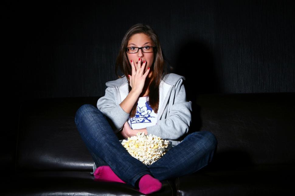 Free Image of Young woman watching a movie 