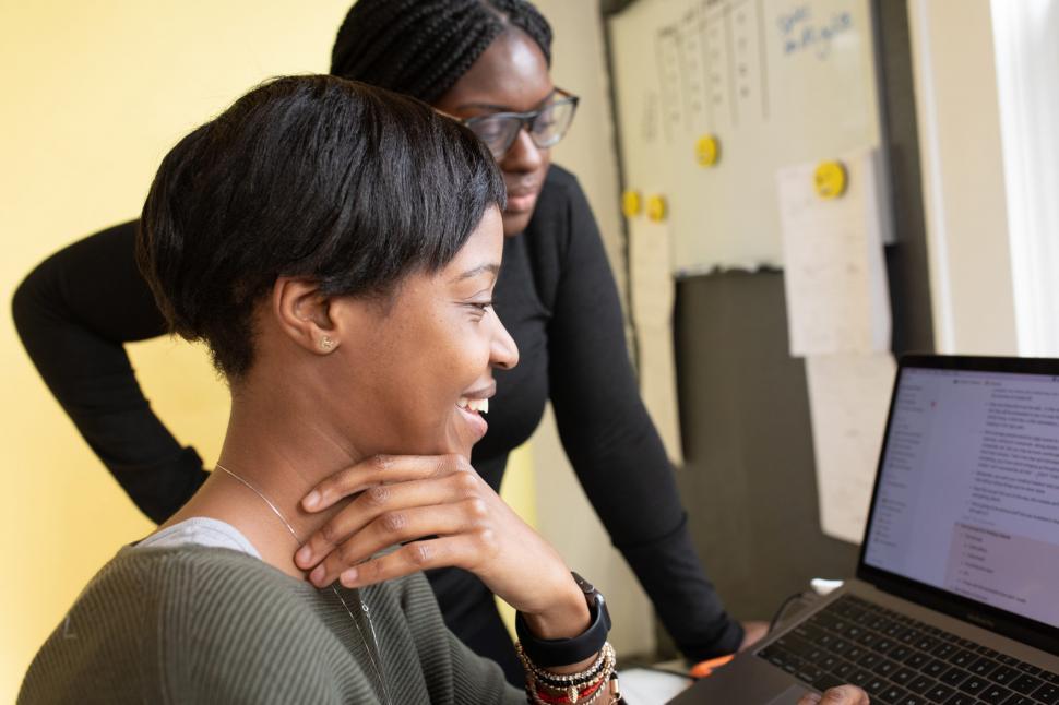 Free Image of Two Young Women Working Together On Office  Laptop 