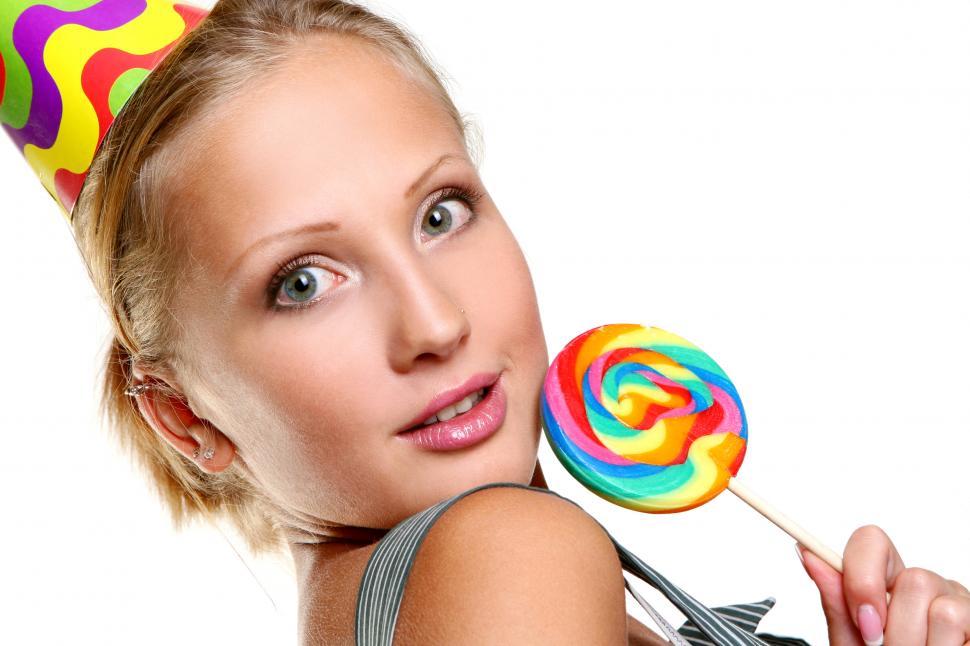 Free Image of young girl with lollipop on white 