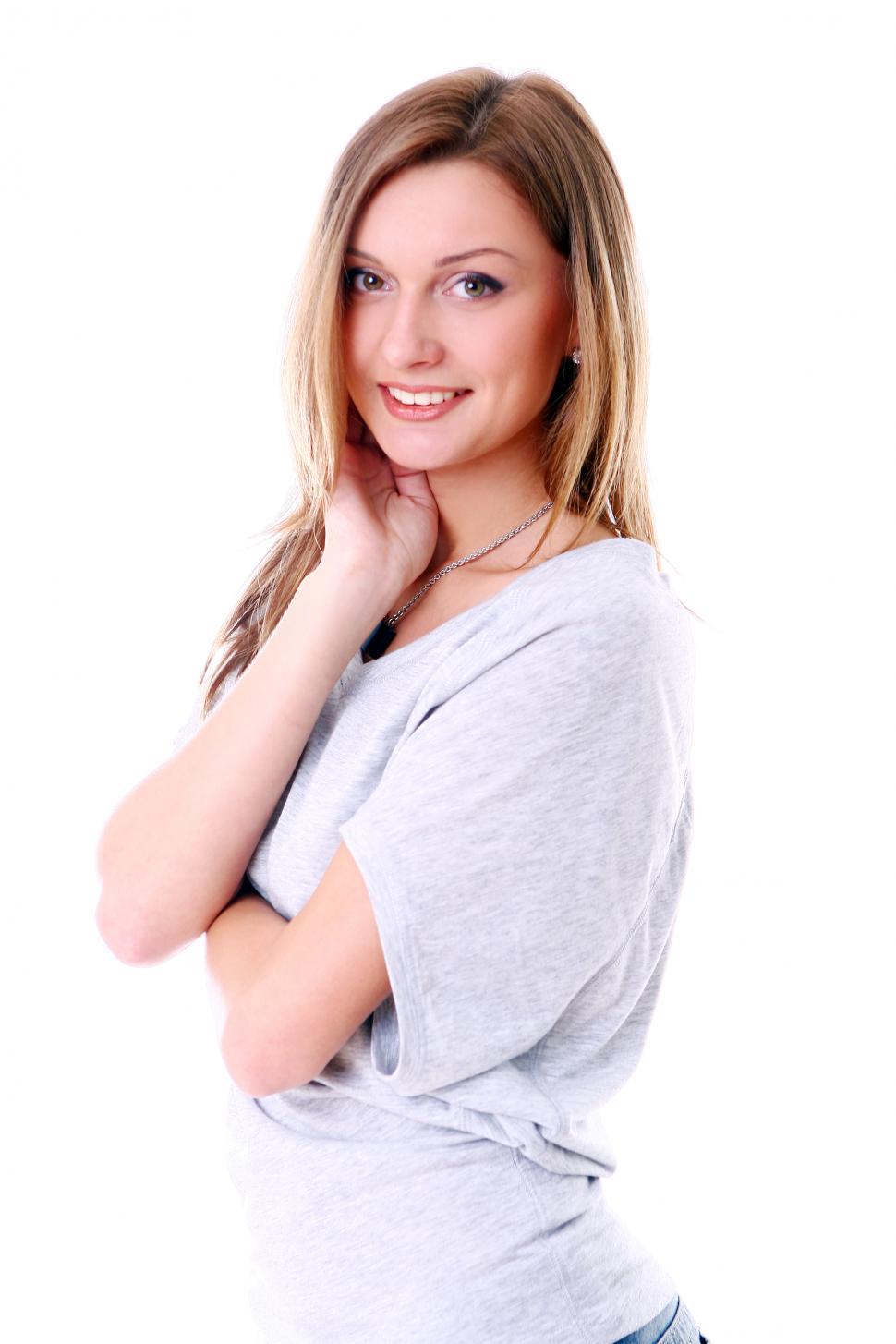 Free Image of Portrait of young woman smiling against white backgr 