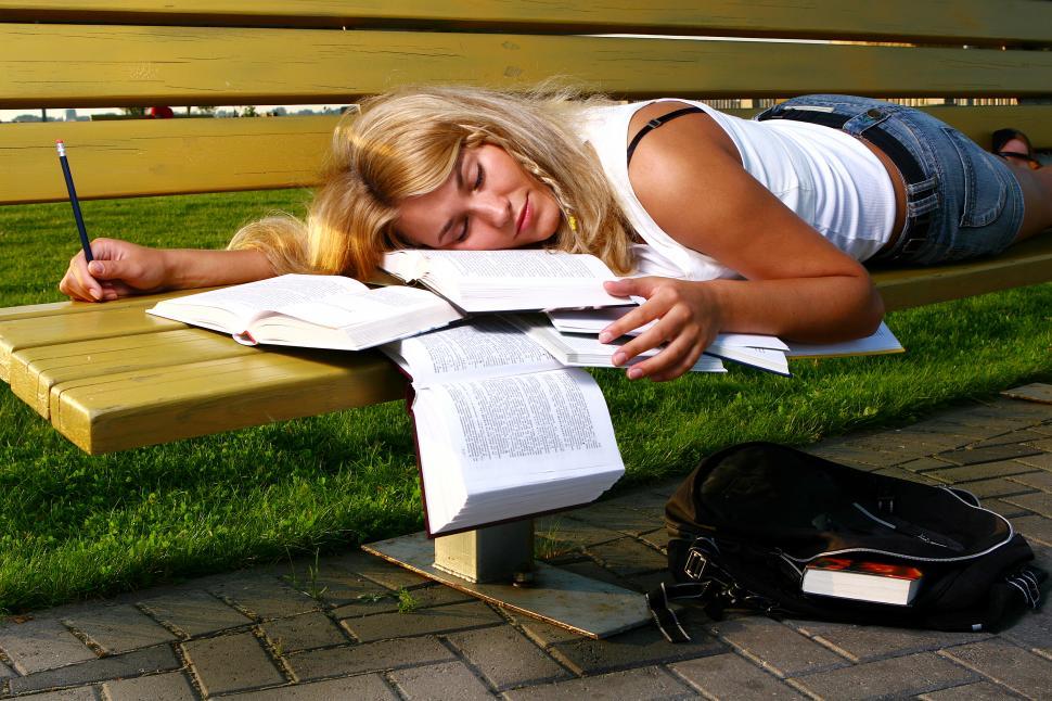 Free Image of young student asleep on the books 