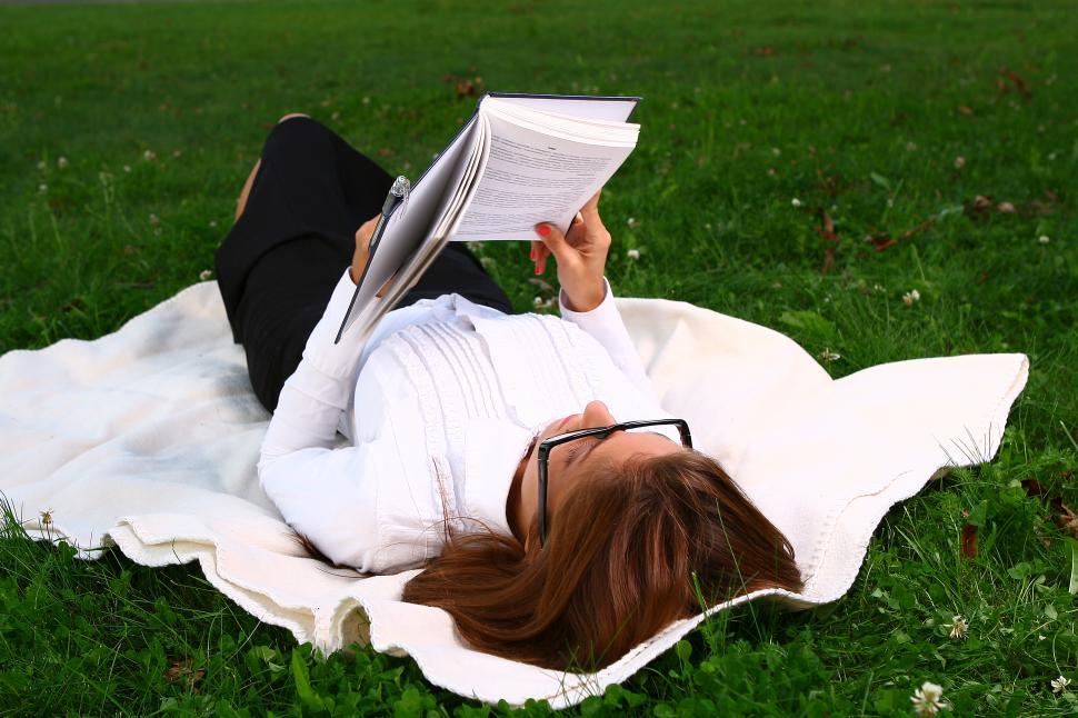 Free Image of young woman studying in park 