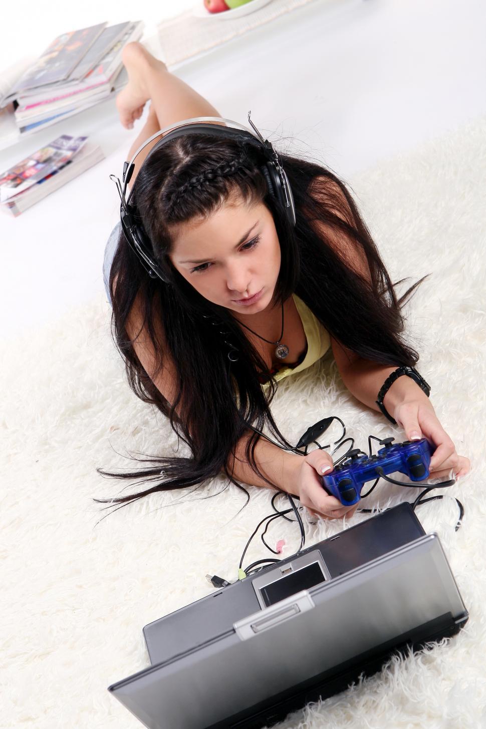 Free Image of Young girl playing video game 