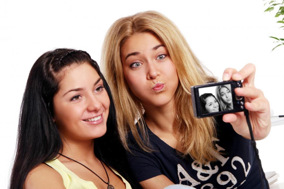 Free Image of Cheerful girlfriends with photo camera 