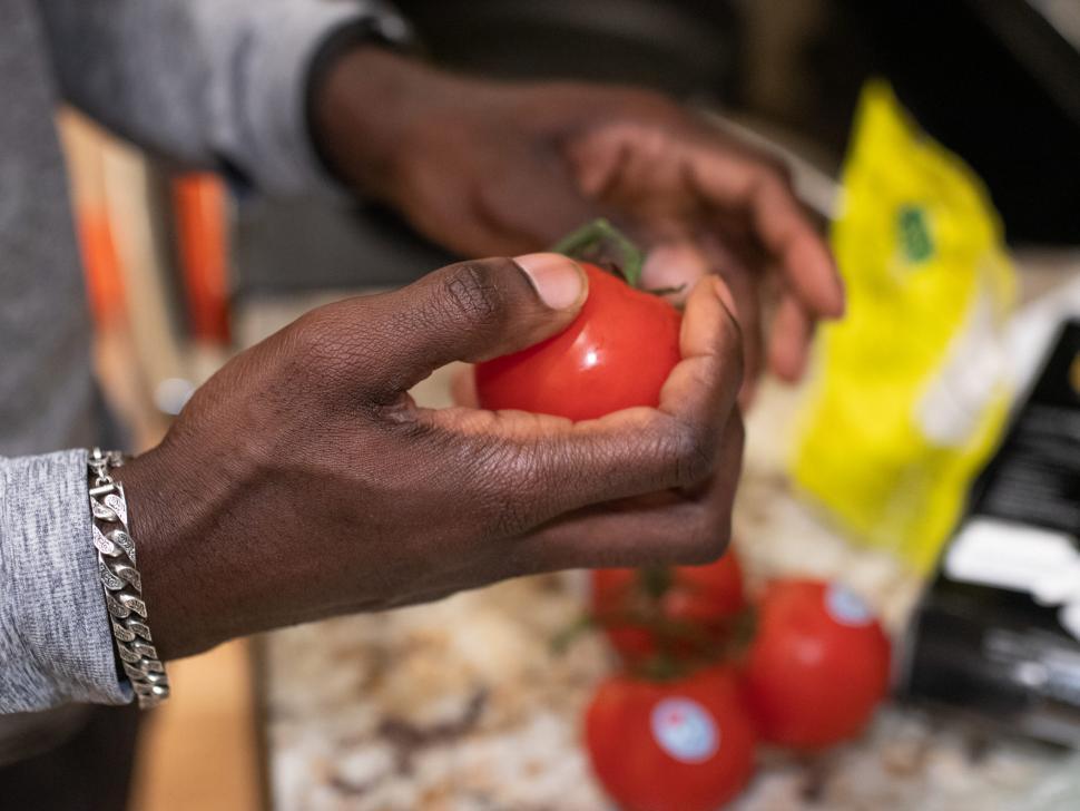 Free Image of Young Man hand with Red Tomato 
