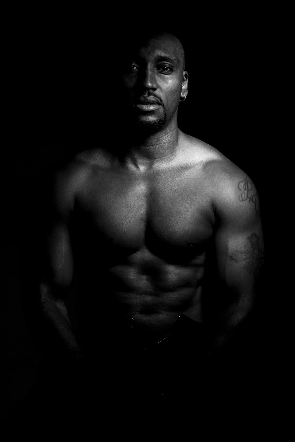 Free Image of Black and white view of muscular man - looking at camera 