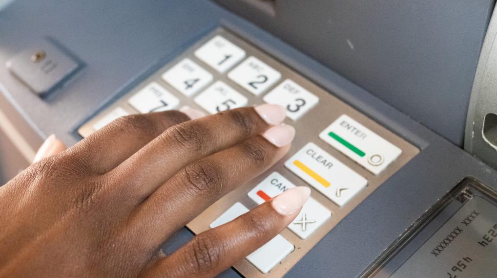 Free Image of Hand Using ATM Keyboard 