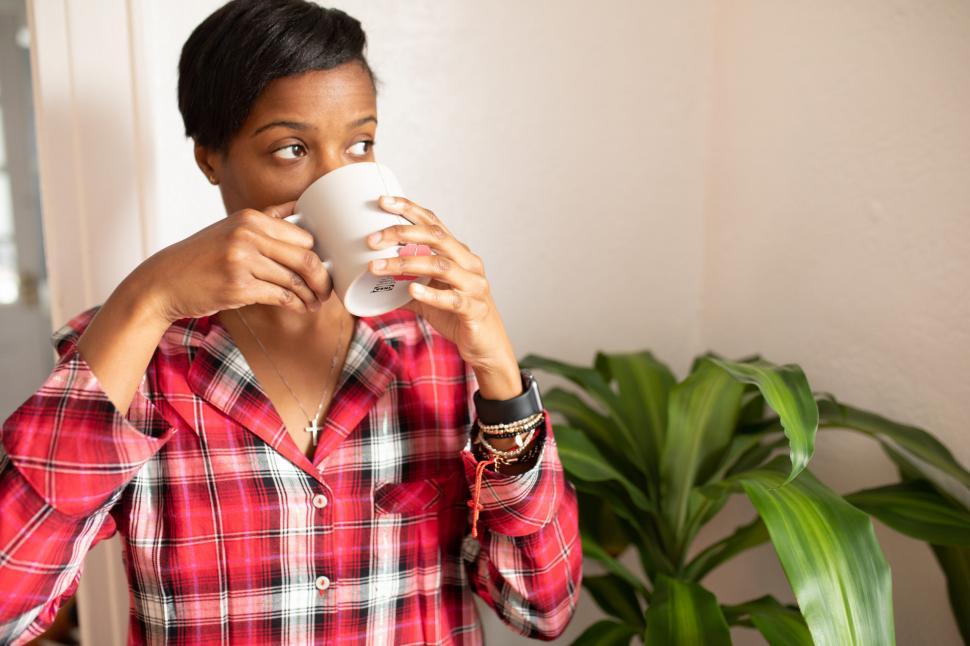 Free Image of Young Woman Drinking Tea at Home 
