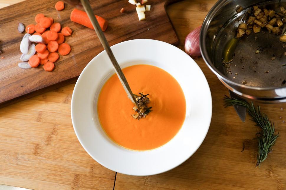 Free Image of Carrot soup on wooden table 