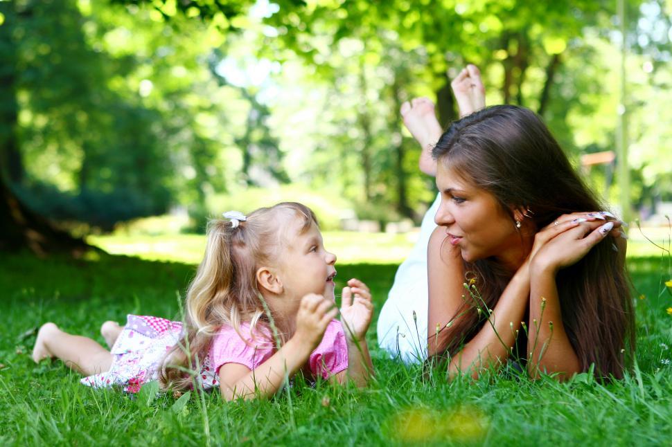 Free Image of sweet girl with mom in grass 