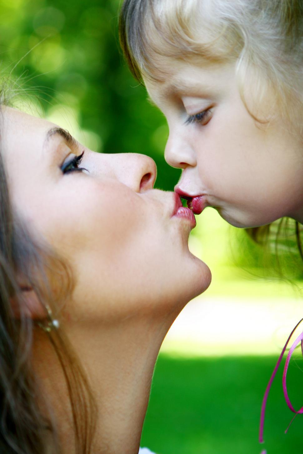 Download Free Stock Photo of mom kissing her child 