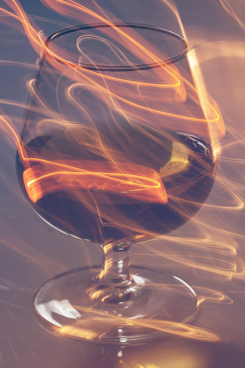 Free Image of Golden glass of whiskey and yellow lines 