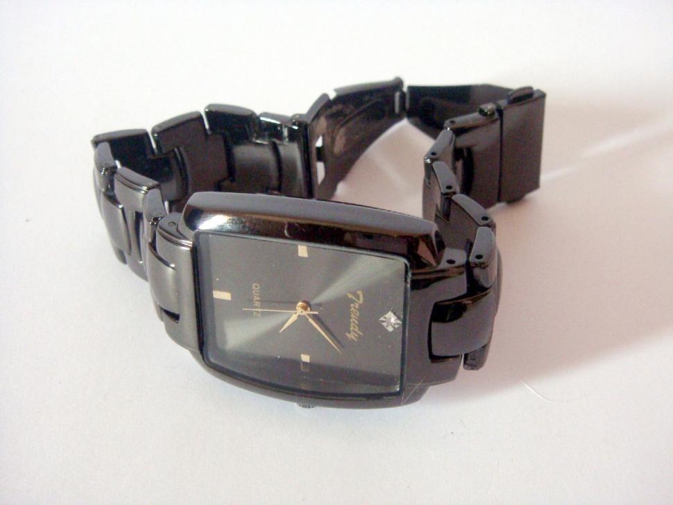 Free Image of Close-Up of Watch on White Surface 