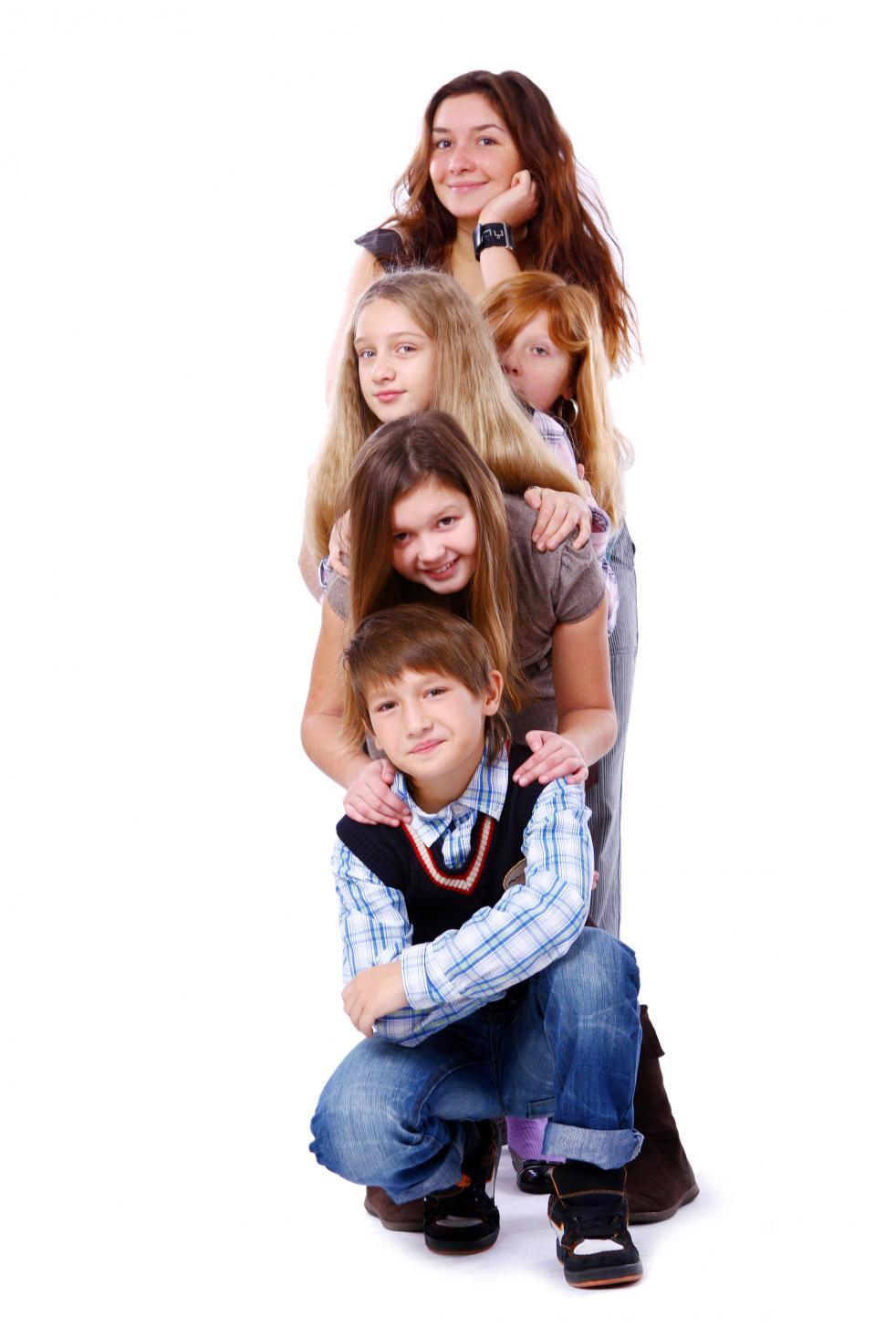 Free Image of Group of cute and happy kids posing on white in a stack 