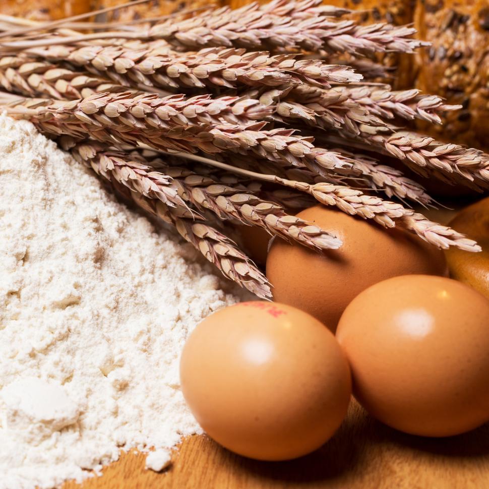 Free Image of Cooking. Raw wheat and eggs in the flour 