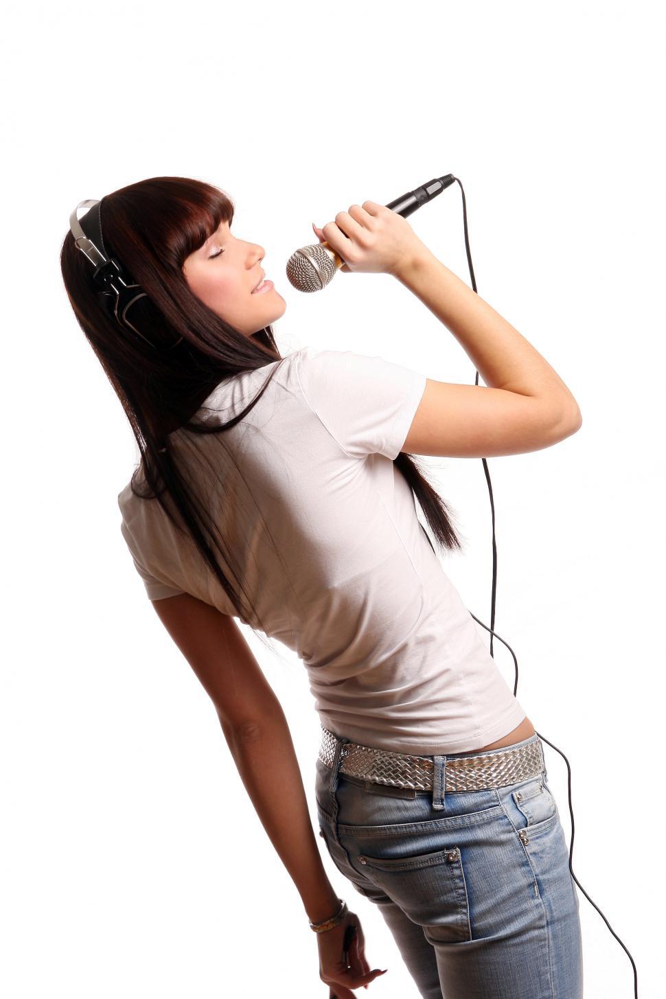 Free Image of young girl on white with microphone 