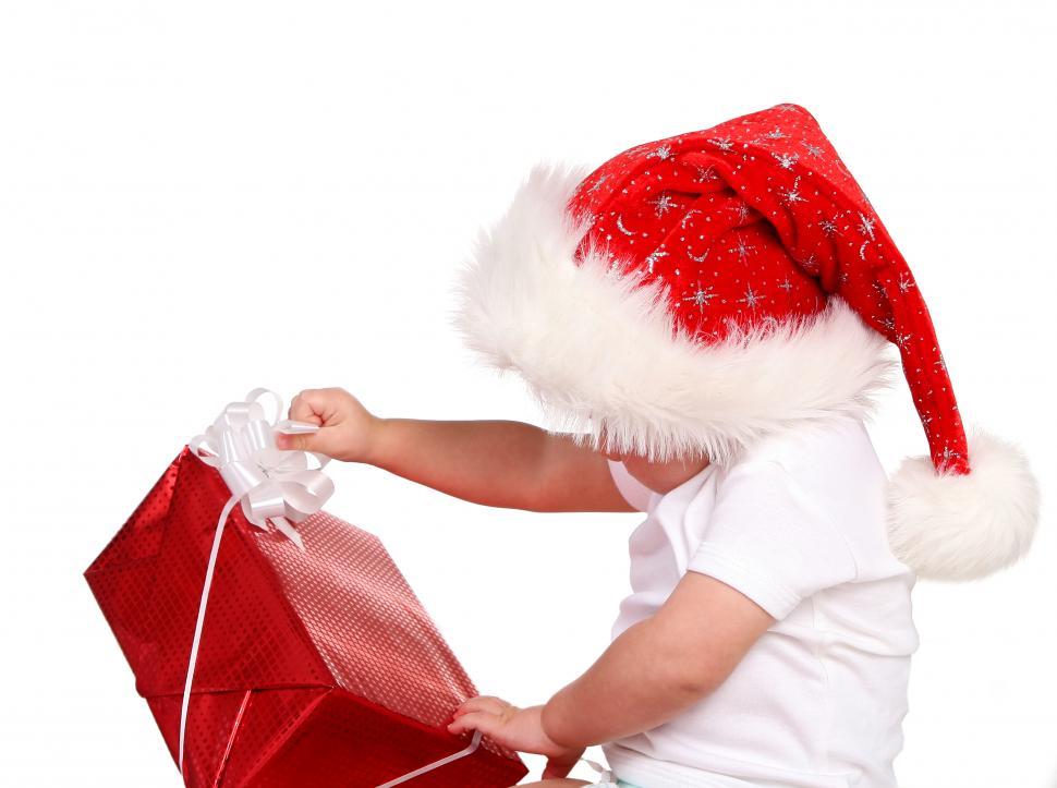 Free Image of child opening Christmas present 