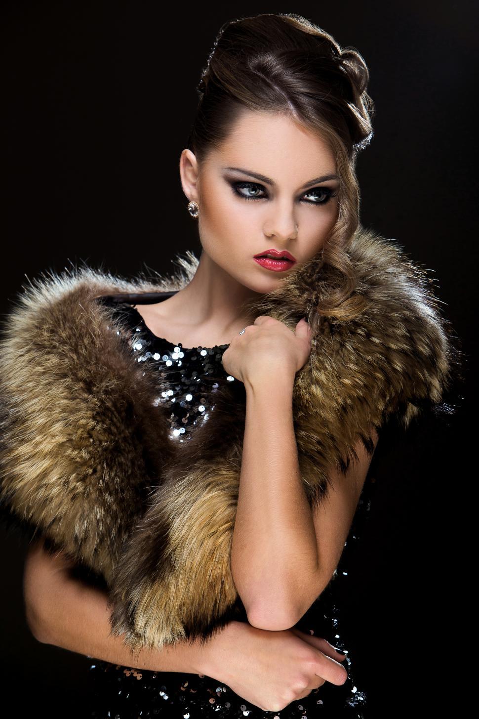 Free Image of Vintage. Beautiful girl wearing fur, dark background 