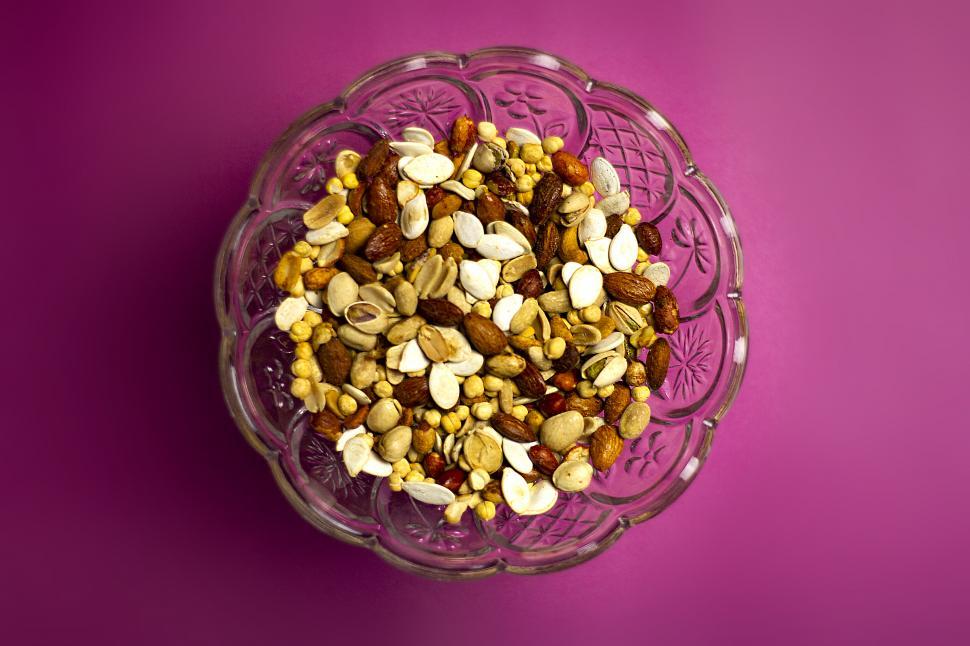 Free Image of Full shot of a dry fruits in a colorful environment  