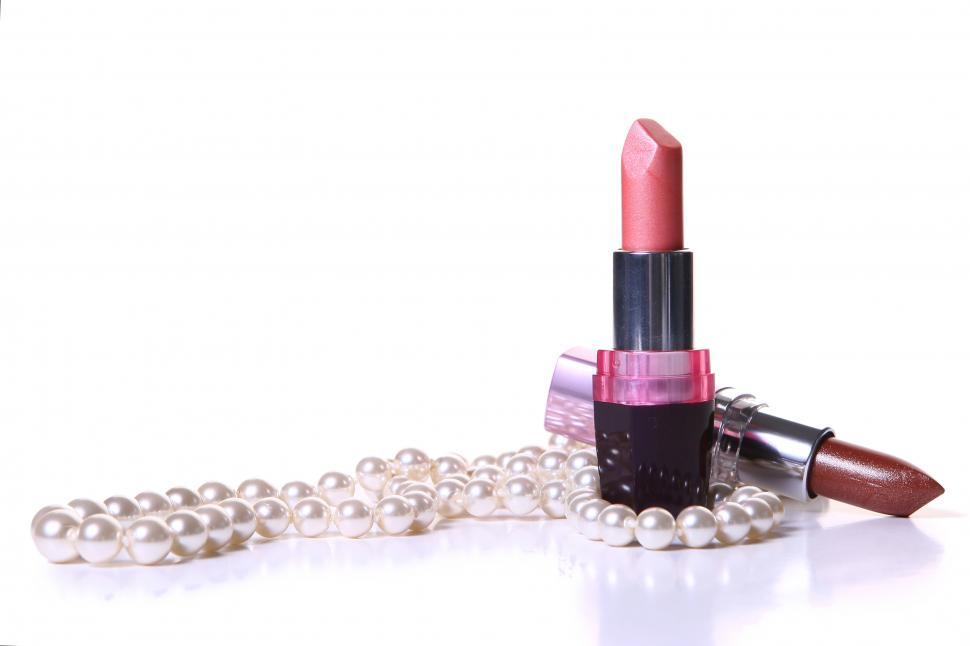 Free Image of Lipstick and pearls on white background 