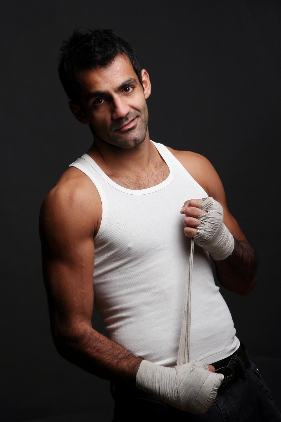 Free Image of Young boxer with had wraps 