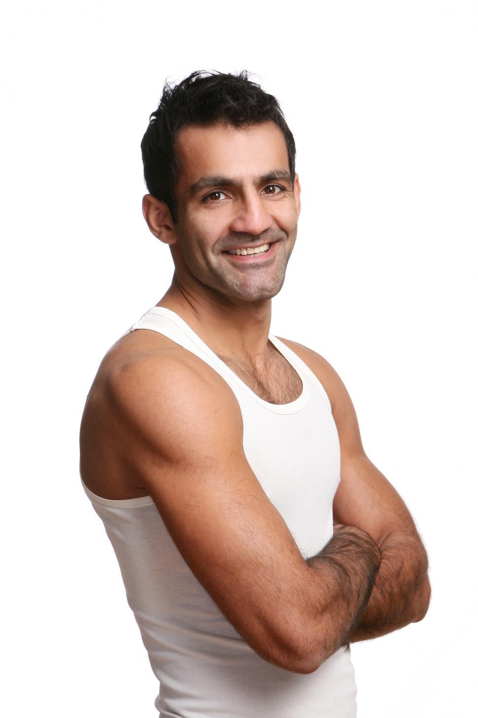 Free Image of Happy young man in white tank top 